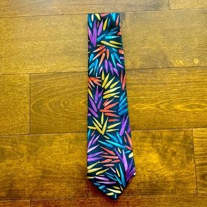 A Oleg Cassini Black tie with stripes of colors.